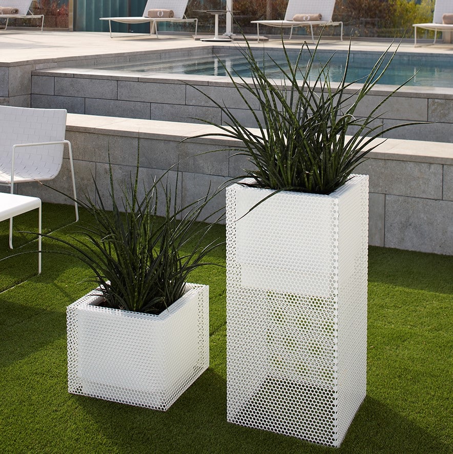Perforated Ferrum planters in white in pool area