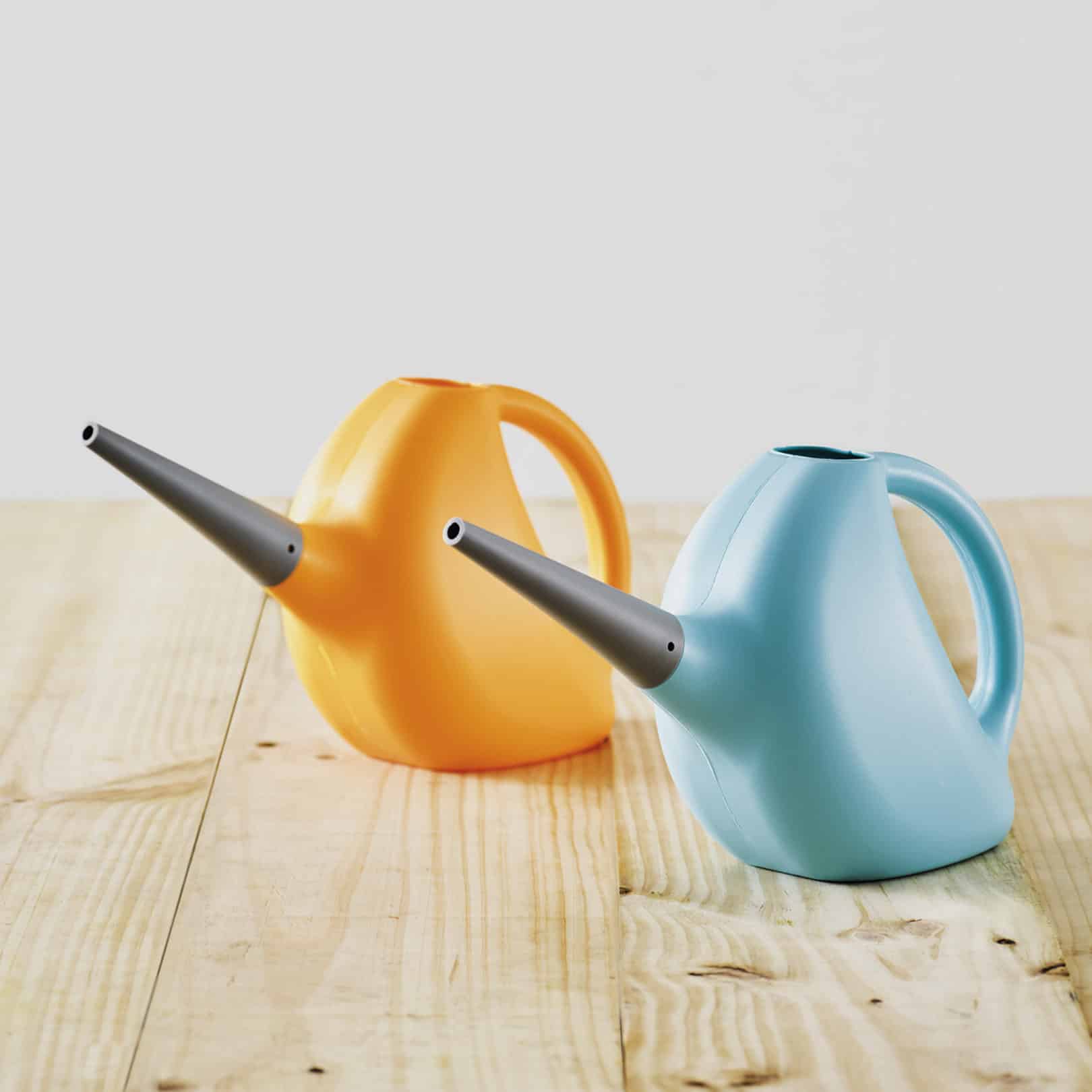 two pinocchio watering cans