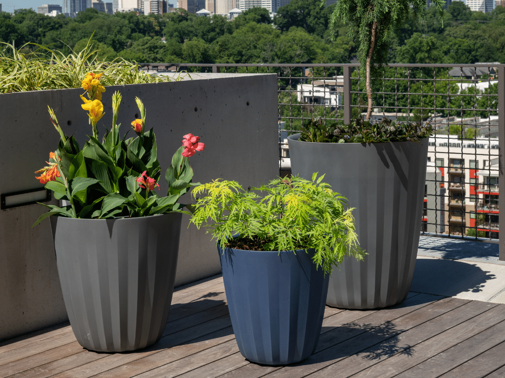 Multicolored planters on a skyrise.