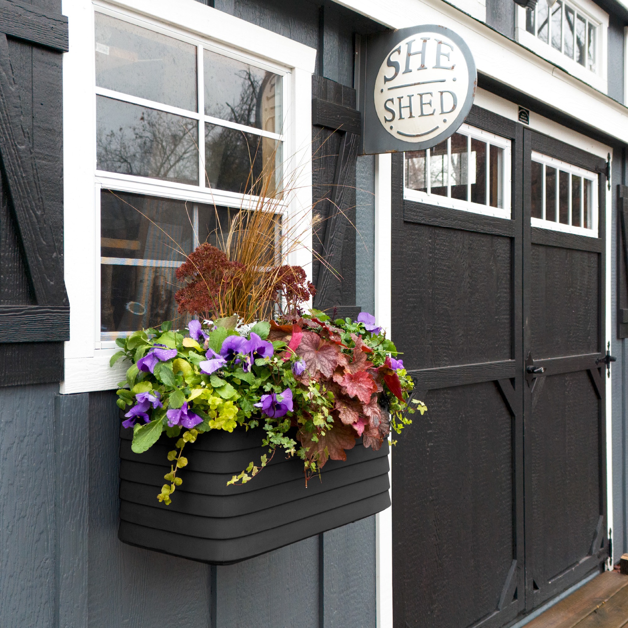 Slat Window Box in Caviar Black mounted on a work shed