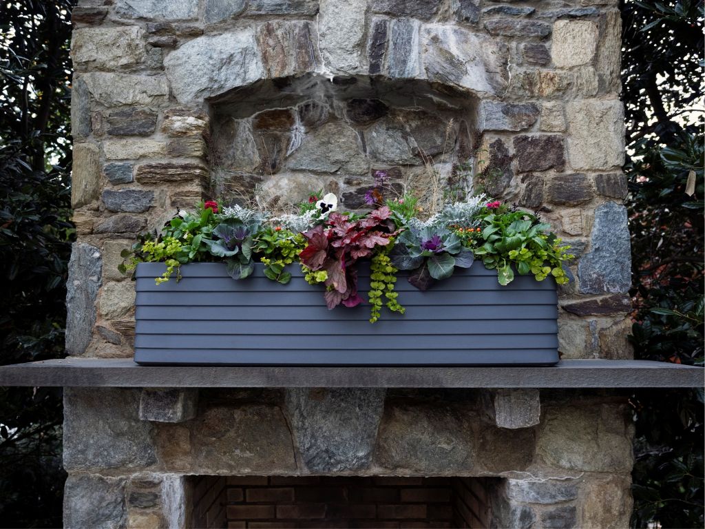 Crescent Garden Slat TruDrop Self-Watering Window Box with holiday planting.